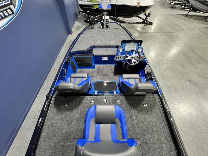 Slide: The Image of 2025 Nitro Z19 Pro boat interior with blue and gray seating, modern dashboard. - 16