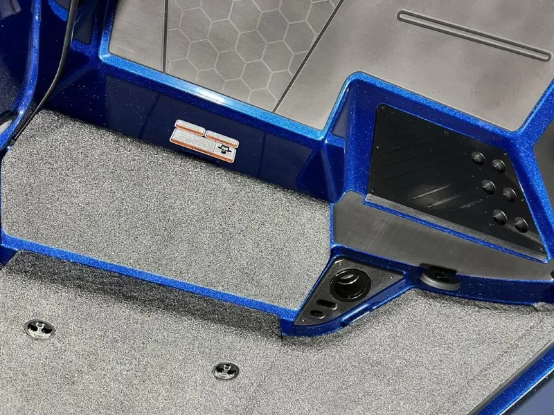 Slide: The Image of 2025 Nitro Z19 Pro boat interior with textured flooring and blue accents. - 17