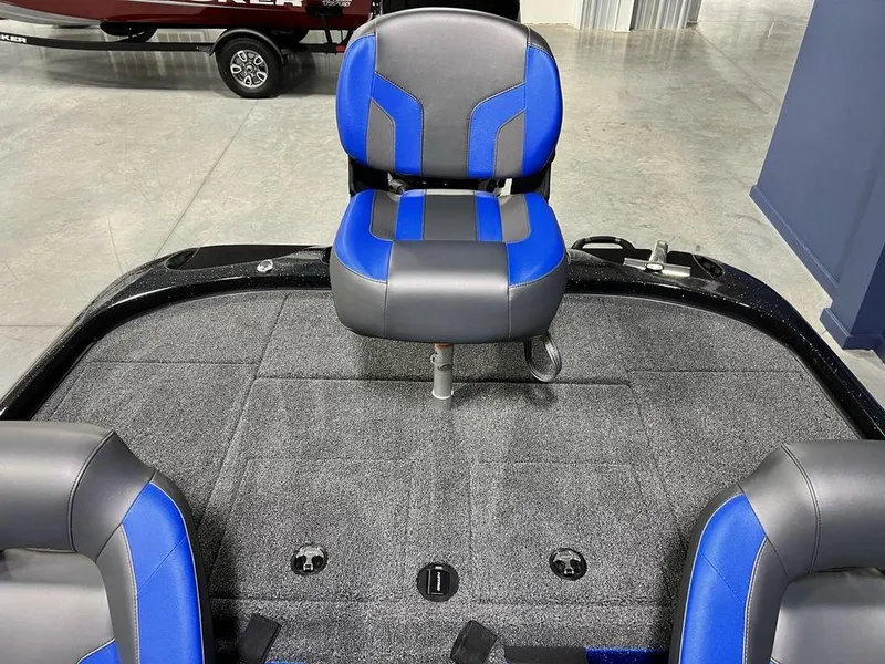Slide: The Image of 2025 Nitro Z19 Pro boat with blue and black seating on a carpeted deck. - 19