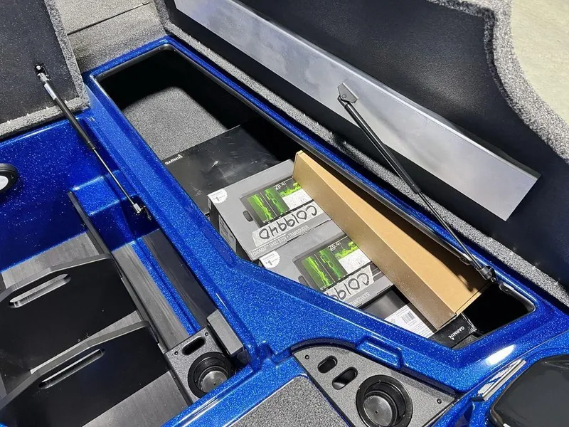 Slide: The Image of 2025 Nitro Z19 Pro boat storage compartment with batteries and equipment. - 27