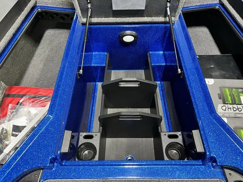 Slide: The Image of 2025 Nitro Z19 Pro boat storage compartment with blue interior and organized layout. - 28