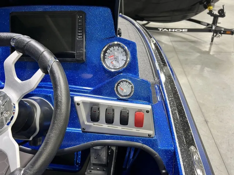 Slide: The Image of 2025 Nitro Z19 Pro boat dashboard with steering wheel, gauges, and control panel. - 3