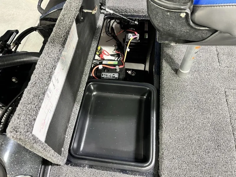 Slide: The Image of Nitro Z19 Pro 2025 boat storage compartment with battery and wiring. - 5