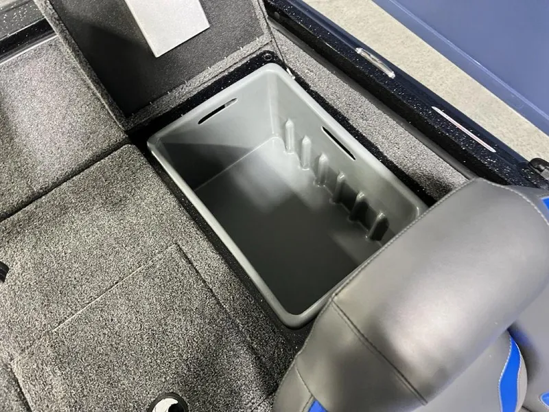 Slide: The Image of 2025 Nitro Z19 Pro boat storage compartment with gray interior and cushioned seating. - 8