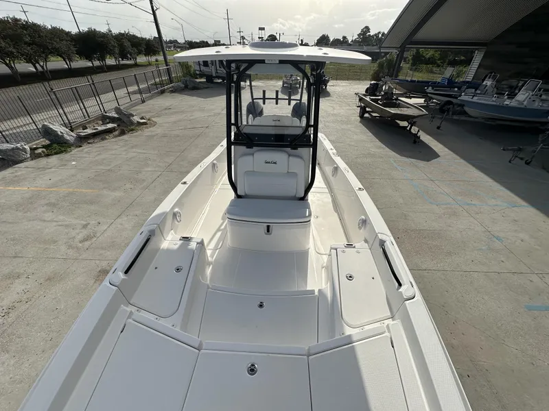 Slide: The Image of 2023 Sea Cat 262 boat on display at a marina. - 13