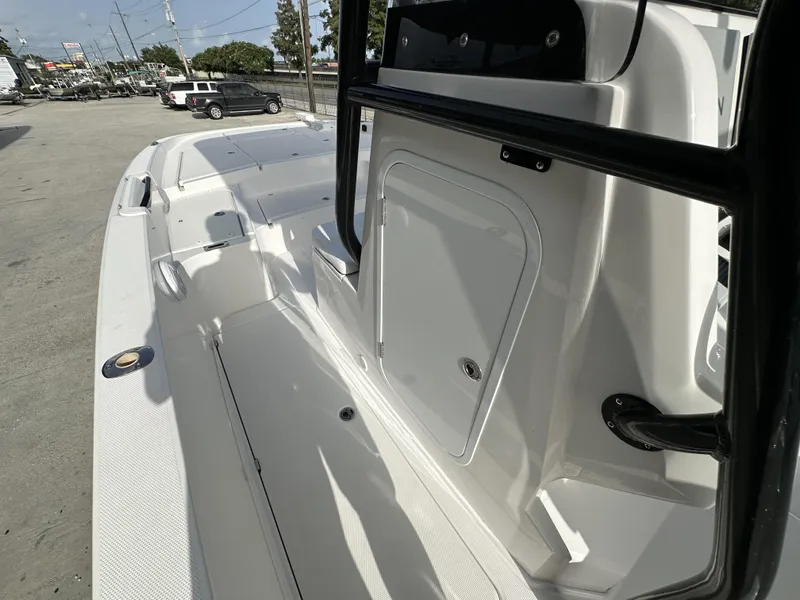 Slide: The Image of 2023 Sea Cat 262 boat interior, white deck, storage compartment, and black railing. - 20