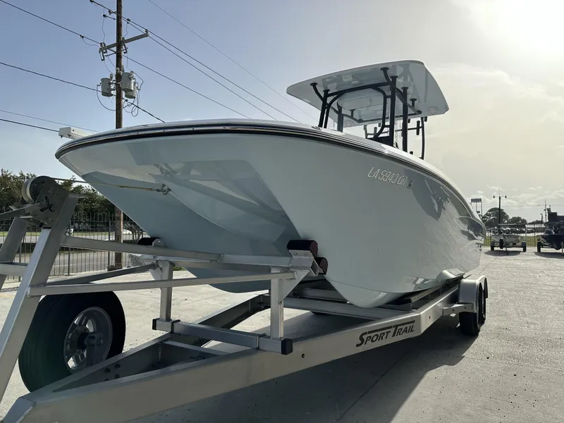 Slide: The Image of 2023 Sea Cat 262 boat on Sport Trail trailer in outdoor setting. - 6