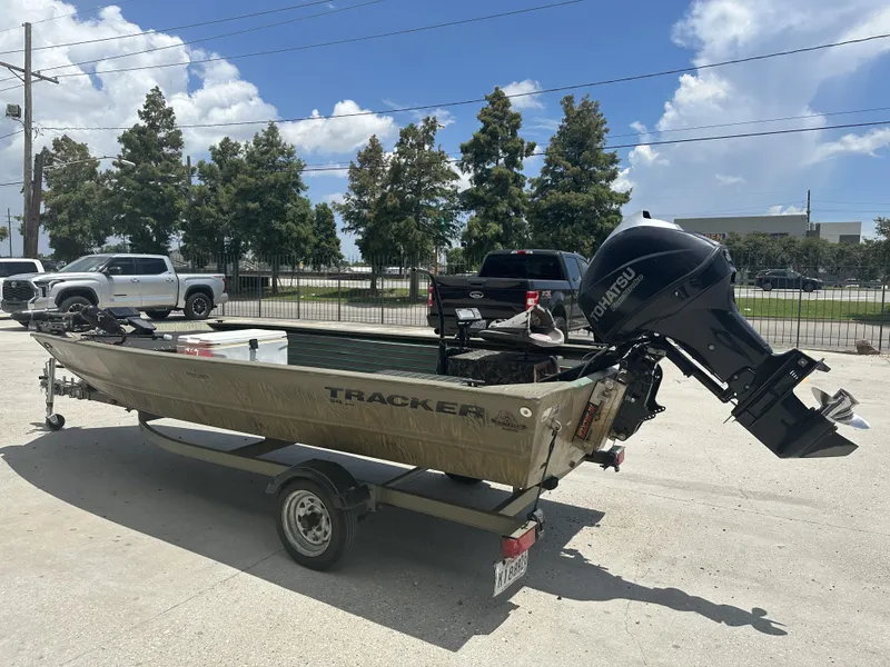 Slide: The Image of 2016 Tracker 1648 boat on trailer with Tohatsu outboard motor. - 10