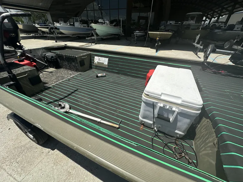 Slide: The Image of 2016 Tracker 1648 boat interior with cooler and equipment. - 7