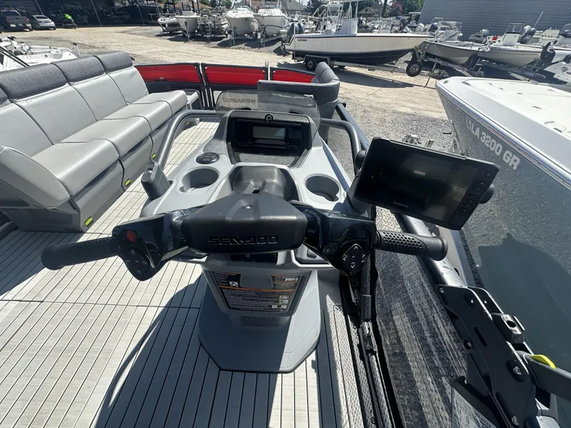Slide: The Image of 2023 Sea-Doo Switch Cruise 21' 230HP dashboard and seating area. - 15