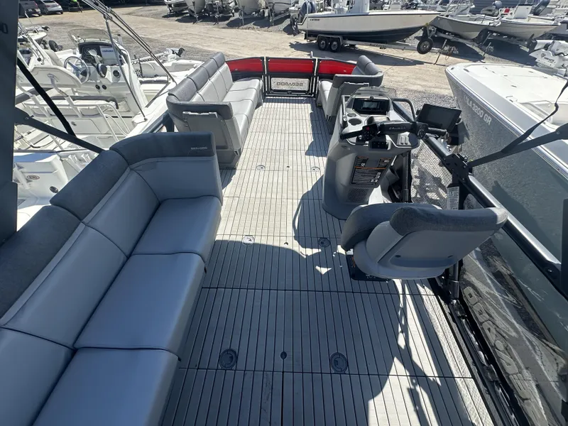 Slide: The Image of 2023 Sea-Doo Switch Cruise 21' - 230HP pontoon boat interior with spacious seating and modern helm. - 2