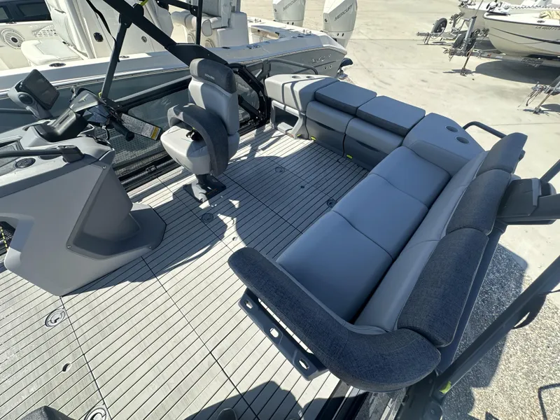 Slide: The Image of 2023 Sea-Doo Switch Cruise 21' - 230HP interior with seating and control console. - 4