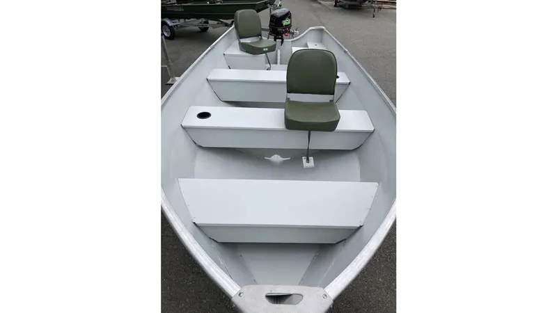 Slide: The Image of 2023 Duranautic DNB14RDS aluminum boat with two green seats and storage compartments. - 2