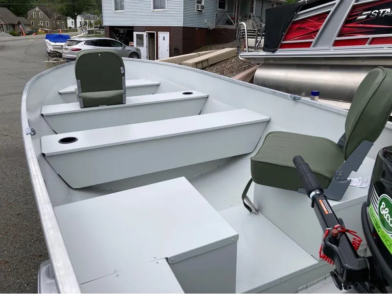 Slide: The Image of 2023 Duranautic DNB14RDS boat interior with green seats and storage compartments. - 4