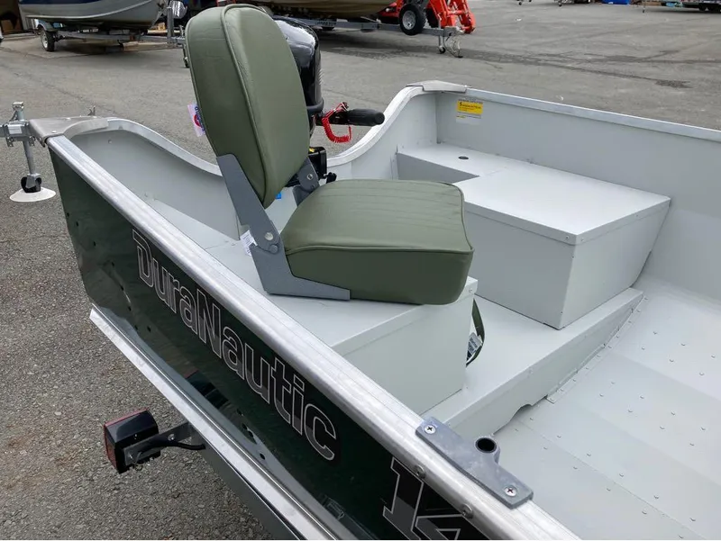 Slide: The Image of 2023 Duranautic DNB14RDS boat with green seat and storage compartments. - 6