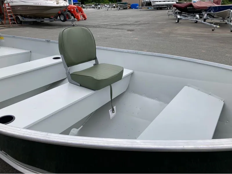 Slide: The Image of 2023 Duranautic DNB14RDS boat interior with green seat, docked in a marina. - 9