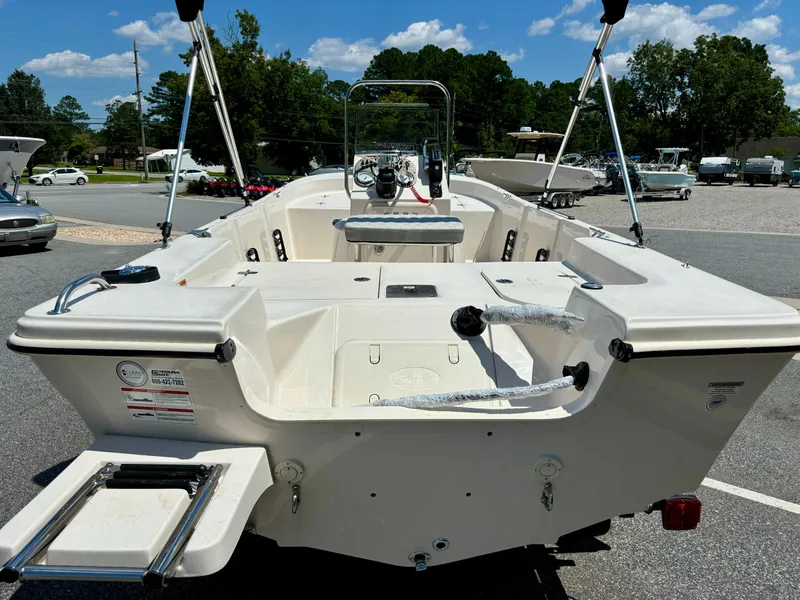 Slide: The Image of 2025 Carolina Skiff 162 JLS boat, white interior, outdoor display, sunny day. - 7
