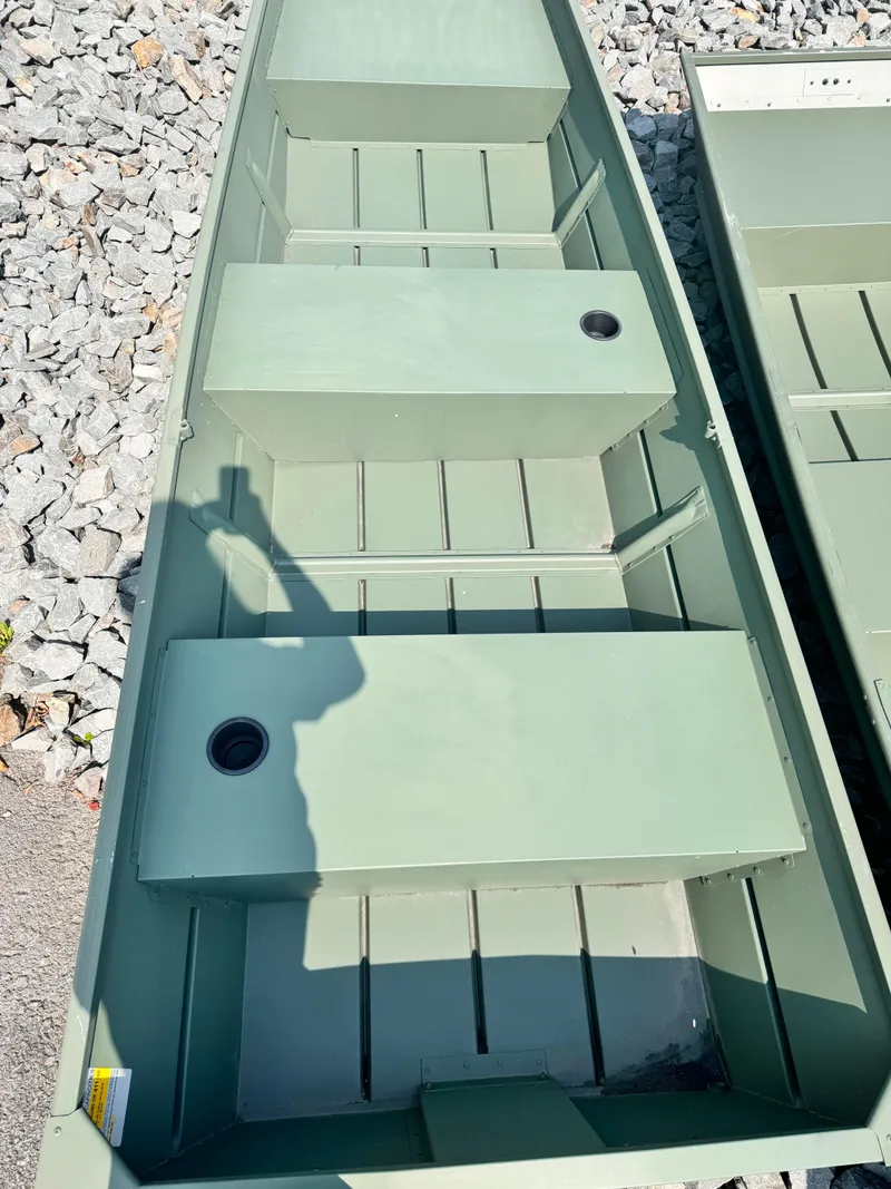 Slide: The Image of 2023 Duranautic DN1236 aluminum boat with bench seats on gravel. - 3