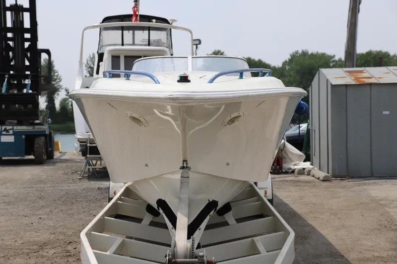 Slide: The Image of 1999 Fountain 42 Staggered boat on trailer, front view, parked outdoors. - 13