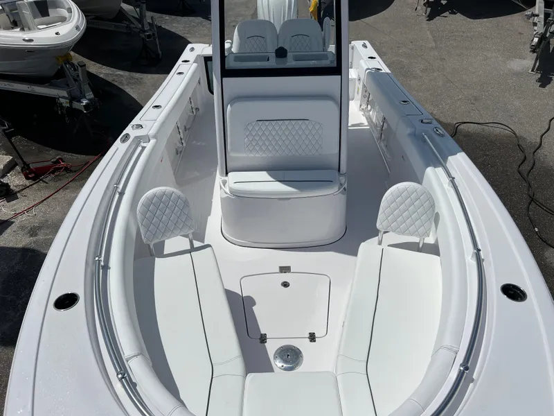 Slide: The Image of 2024 Sportsman Open 232 Center Console boat with spacious seating and modern design. - 11