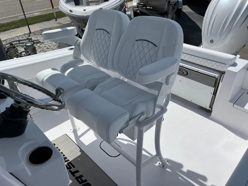Slide: The Image of 2024 Sportsman Open 232 Center Console boat seating and helm station. - 12