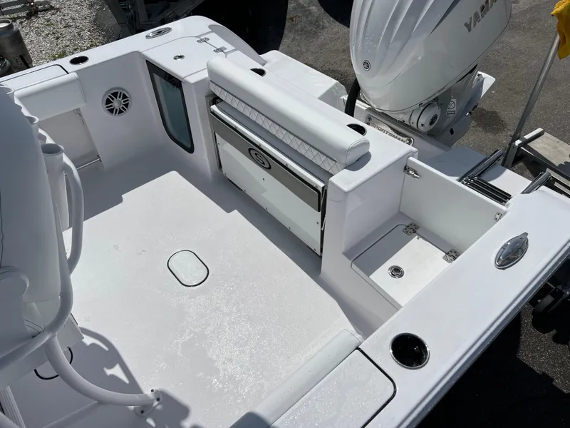Slide: The Image of 2024 Sportsman Open 232 Center Console boat interior with seating and storage compartments. - 13