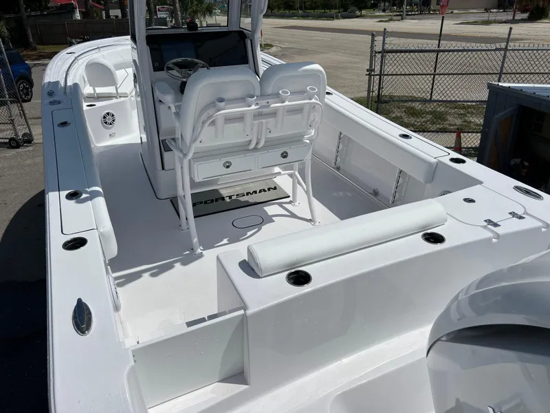 Slide: The Image of 2024 Sportsman Open 232 Center Console boat interior with seating and console. - 4