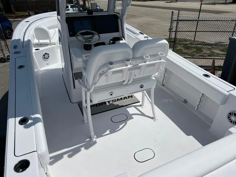 Slide: The Image of 2024 Sportsman Open 232 Center Console boat interior with dual helm seats and console. - 5
