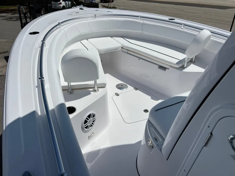 Slide: The Image of 2024 Sportsman Open 232 Center Console boat interior with seating and speaker. - 9
