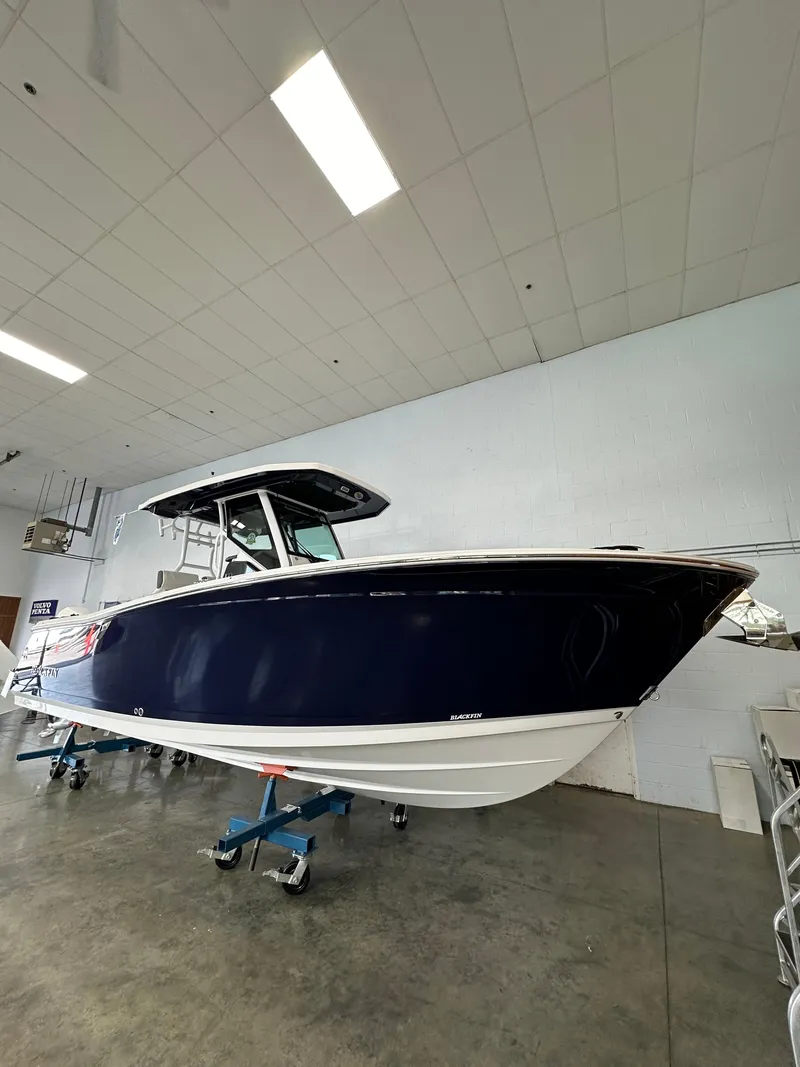Slide: The Image of 2023 Blackfin 272 CC boat in showroom. - 0