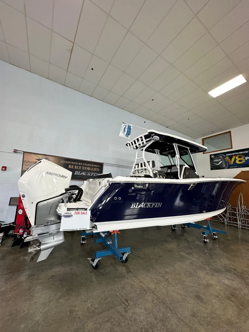 Slide: The Image of 2023 Blackfin 272 CC boat on display in showroom. - 1