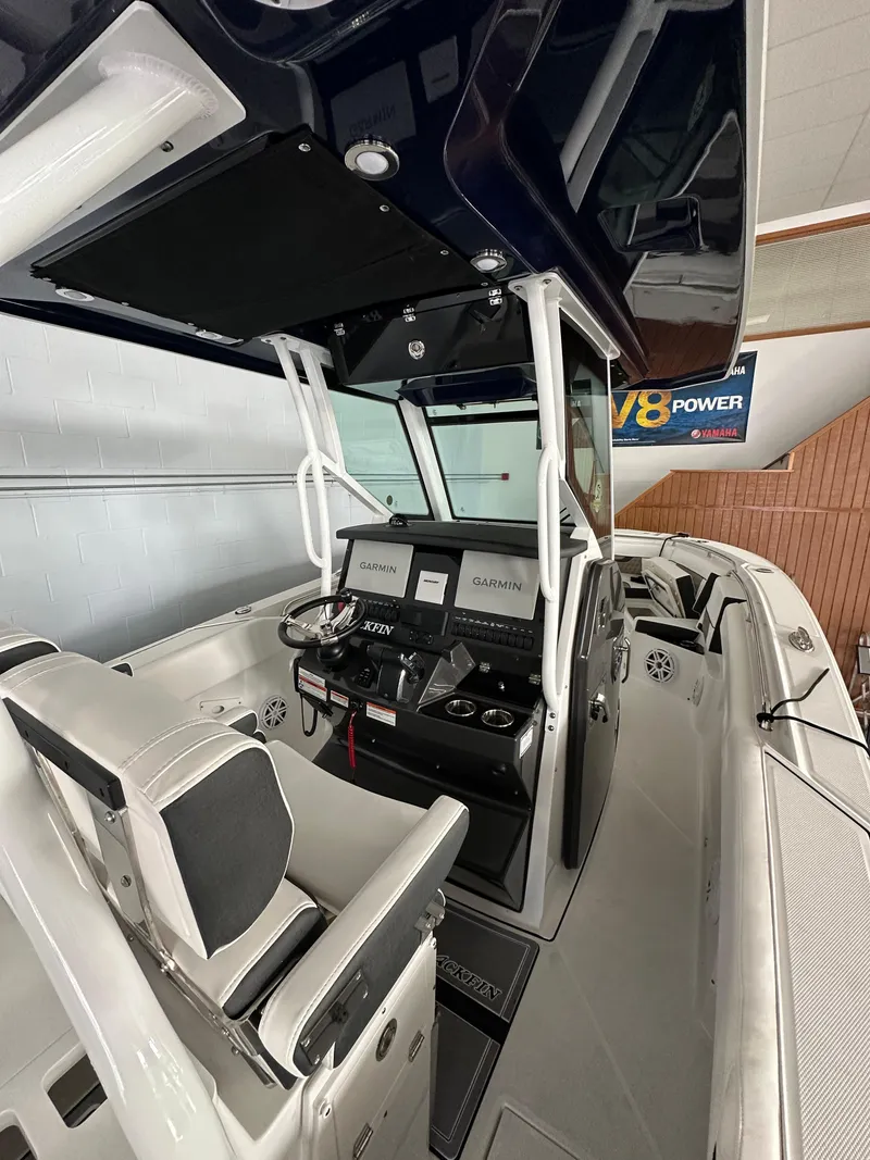 Slide: The Image of 2023 Blackfin 272 CC center console boat interior with advanced navigation systems. - 2