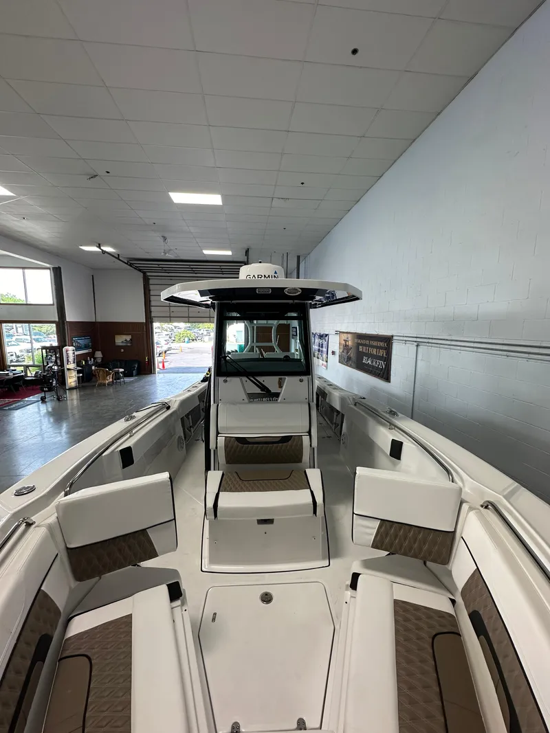 Slide: The Image of 2023 Blackfin 272 CC center console boat in showroom. - 4