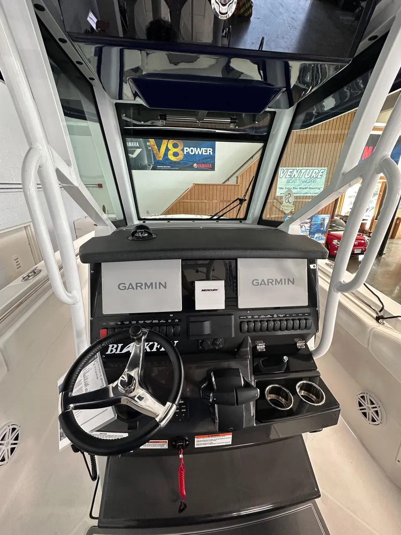 Slide: The Image of 2023 Blackfin 272 CC boat dashboard with Garmin navigation system. - 7