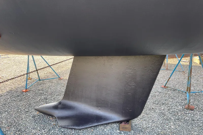 Slide: The Image of Keel of a 1997 Beneteau First 42s7 sailboat on stands. - 28
