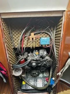 Slide: The Image of Engine compartment of a 1997 Beneteau 42S7 sailboat with visible wiring and components. - 4