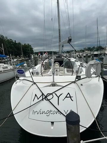 Slide: The Image of 1997 Beneteau 42S7 sailboat docked, named "MOYA," in Irvington, VA marina. - 8