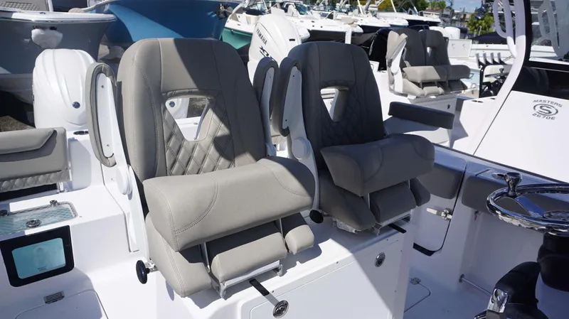 Slide: The Image of 2025 Sportsman 261 Heritage boat seats, featuring luxurious gray upholstery and ergonomic design. - 10