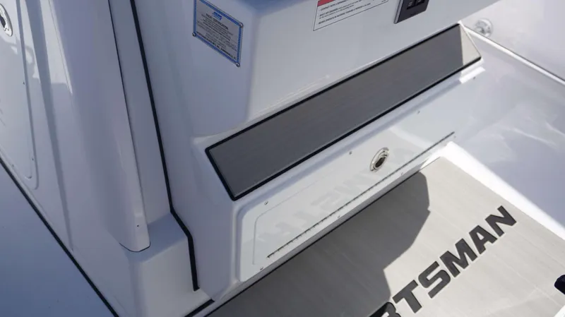 Slide: The Image of 2025 Sportsman 261 Heritage boat interior detail with logo and control panel. - 20