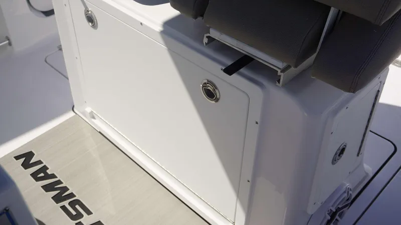 Slide: The Image of 2025 Sportsman 261 Heritage boat interior, featuring storage compartment and seating. - 21