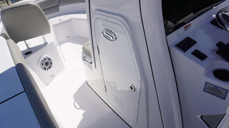 Slide: The Image of 2025 Sportsman 261 Heritage boat interior with seating and control panel. - 22