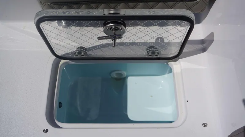 Slide: The Image of Open storage compartment on 2025 Sportsman 261 Heritage boat. - 25