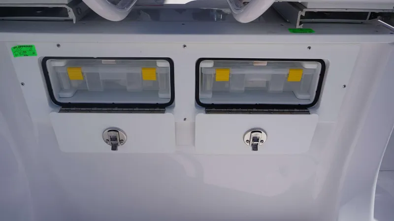 Slide: The Image of Storage compartments on a 2025 Sportsman 261 Heritage boat console. - 27