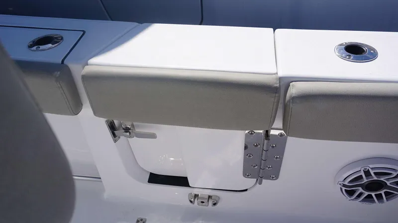 Slide: The Image of Sportsman 261 Heritage 2025 boat seating with storage compartment and speaker. - 28