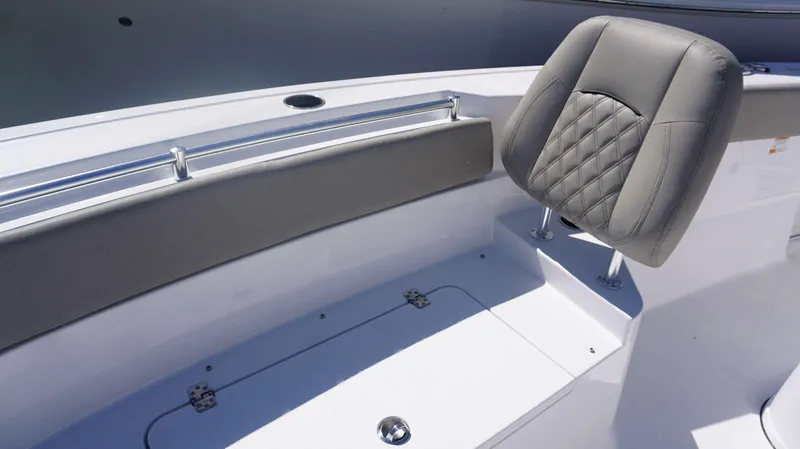 Slide: The Image of 2025 Sportsman 261 Heritage boat seating with gray upholstery and storage compartment. - 5