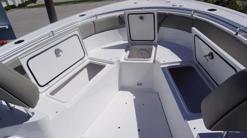 Slide: The Image of 2025 Sportsman 261 Heritage boat interior with open storage compartments. - 7
