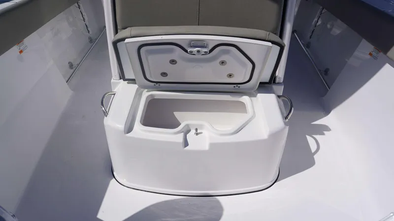 Slide: The Image of 2025 Sportsman 261 Heritage boat storage compartment with open lid. - 8