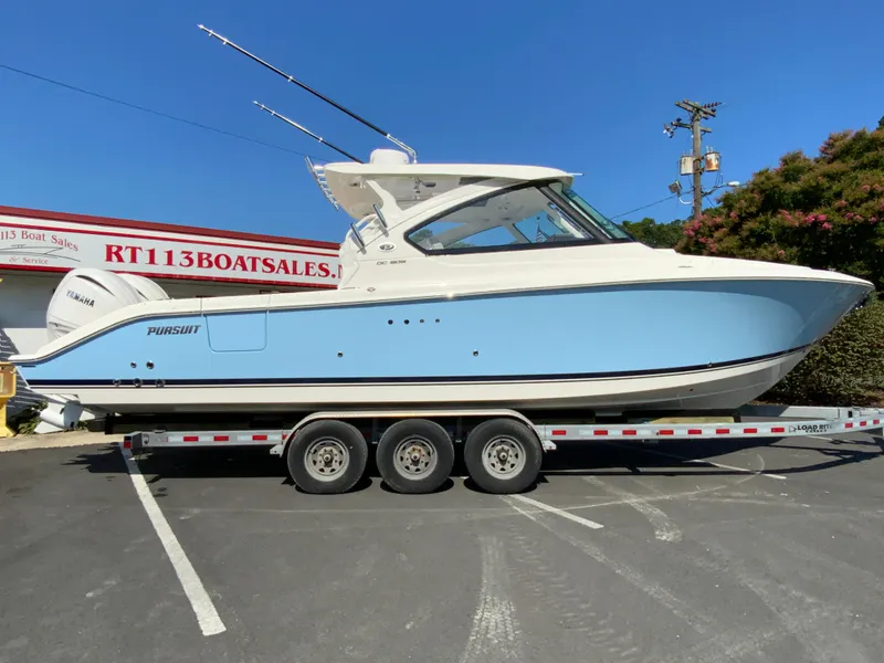 Slide: The Image of 2025 Pursuit DC 306 Dual Console boat on a trailer at RT113 Boat Sales. - 1