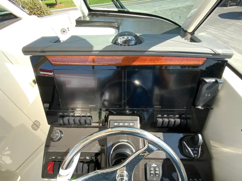 Slide: The Image of 2025 Pursuit DC 306 Dual Console helm with dual displays and modern controls. - 19