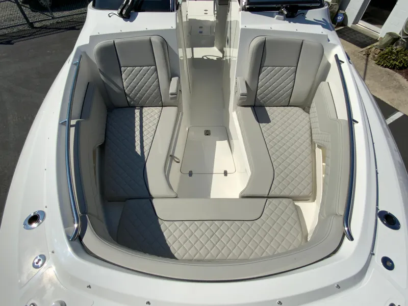 Slide: The Image of 2025 Pursuit DC 306 Dual Console boat interior with luxurious seating. - 33